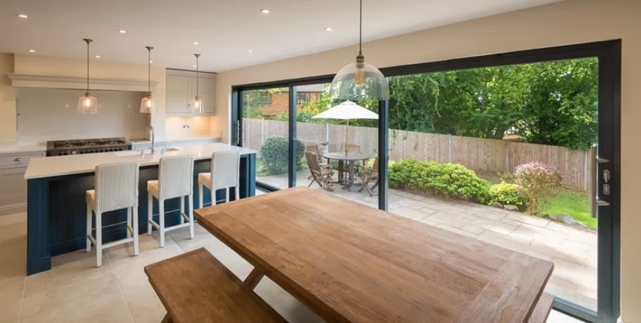 Origin OS-44 aluminium sliding door, open onto a garden