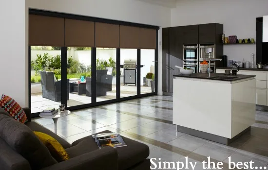 Black bifold doors with blinds in a modern open-plan kitchen and living space