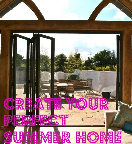 Oak-framed garden room with bifold doors open onto a terrace