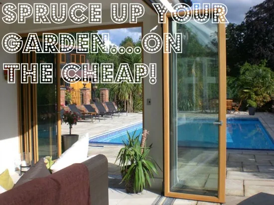 Timber bifold doors opening onto a poolside garden